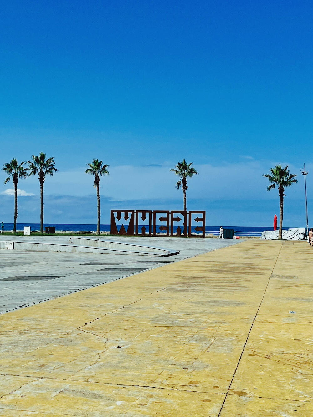 Batumi: New Boulevard Where sign and beach